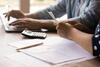 Couple looks at finances at home close up